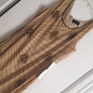 This is a long gorgeous gold dress with sequins.